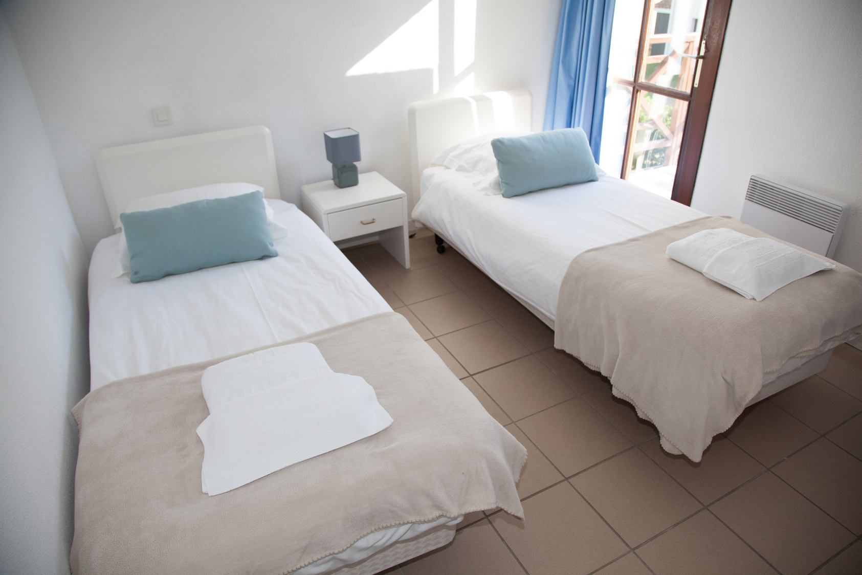 Bedroom in an hotel with two single beds